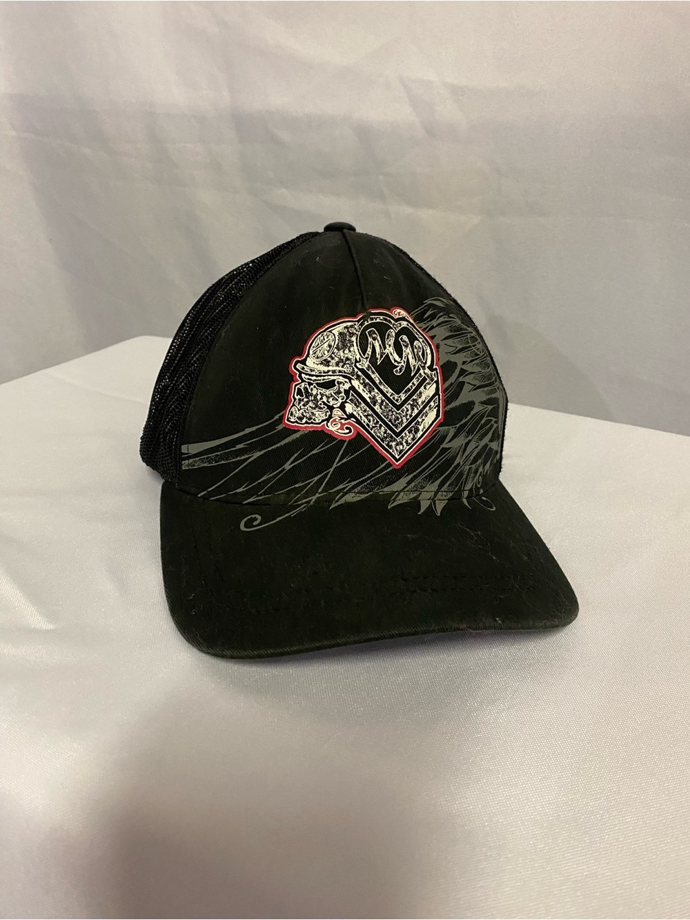Metal Mulisha Woman’s Black Trucker Cap with Pink Embroidered Graphic Skull